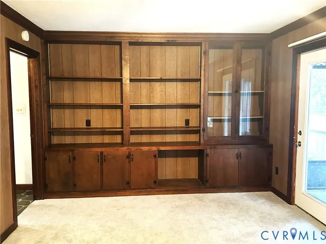 a view of wooden floor and windows in a room