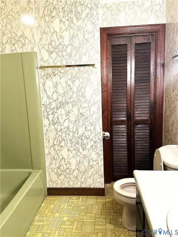 a view of an empty room and wooden floor