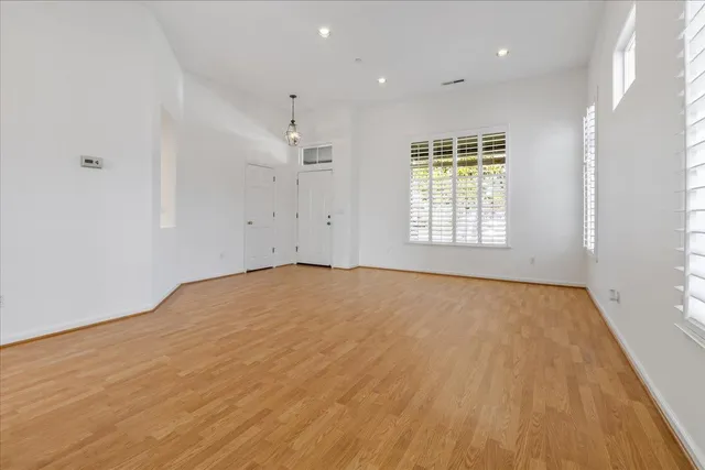 an empty room with a natural light cabinetry