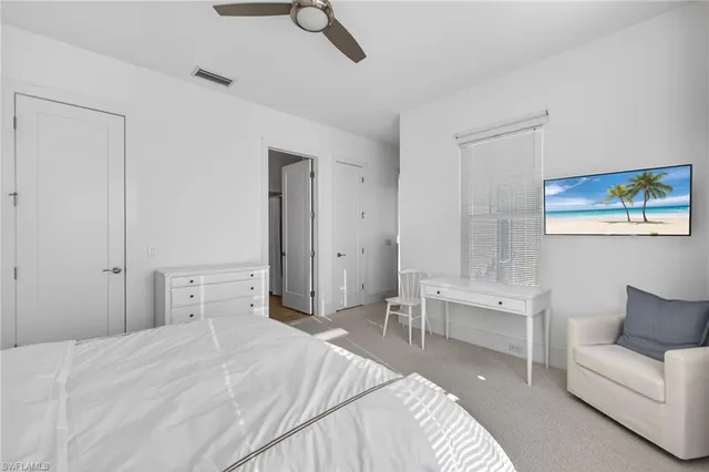 a bedroom with a bed and a couch