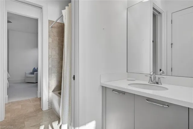 a bathroom with a sink and a mirror