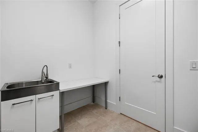 a view of cabinets and utility room