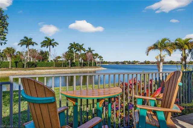 a view of a chair and table in the balcony