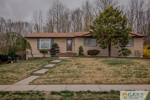 22 Kings Road East Brunswick, NJ 08816 - Photo 1 of 24 a front view of a house with garden
