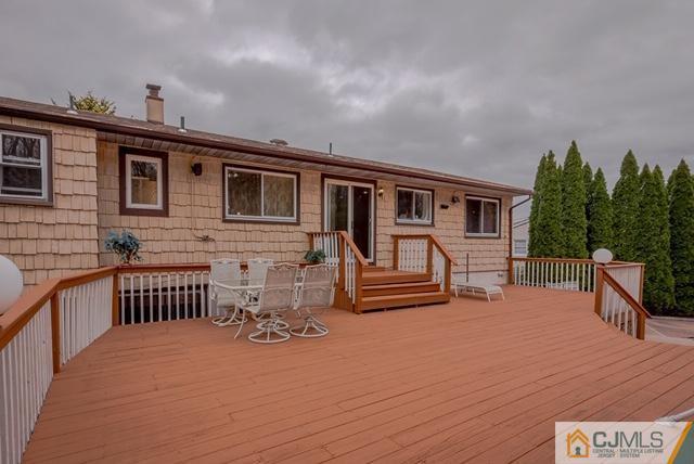 22 Kings Road East Brunswick, NJ 08816 - Photo 2 of 24 a view of a house with wooden deck and furniture