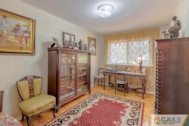 22 Kings Road East Brunswick, NJ 08816 - Photo 12 of 24 a living room with furniture and a window