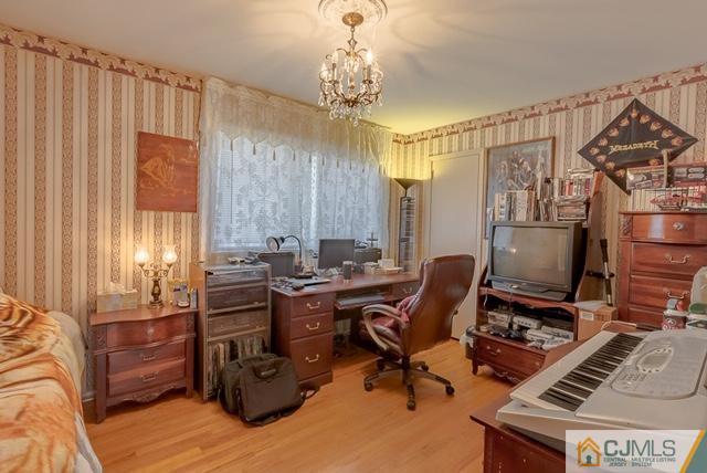 22 Kings Road East Brunswick, NJ 08816 - Photo 13 of 24 a view of a workspace with furniture and a window