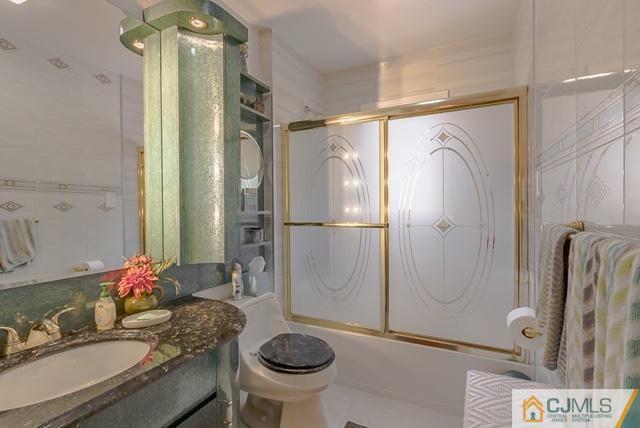 22 Kings Road East Brunswick, NJ 08816 - Photo 14 of 24 a bathroom with a granite countertop sink toilet and shower