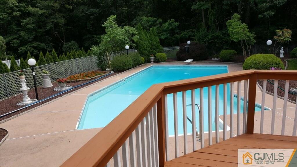 22 Kings Road East Brunswick, NJ 08816 - Photo 24 of 24 a view of swimming pool with a patio