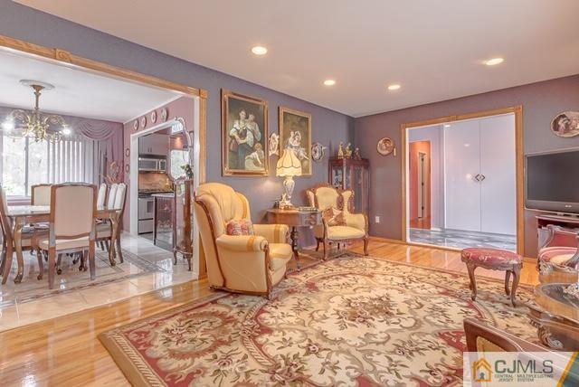 22 Kings Road East Brunswick, NJ 08816 - Photo 5 of 24 a living room with furniture and a rug