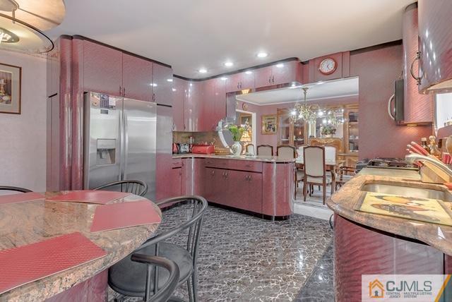 22 Kings Road East Brunswick, NJ 08816 - Photo 8 of 24 a kitchen with granite countertop a sink cabinets and stainless steel appliances