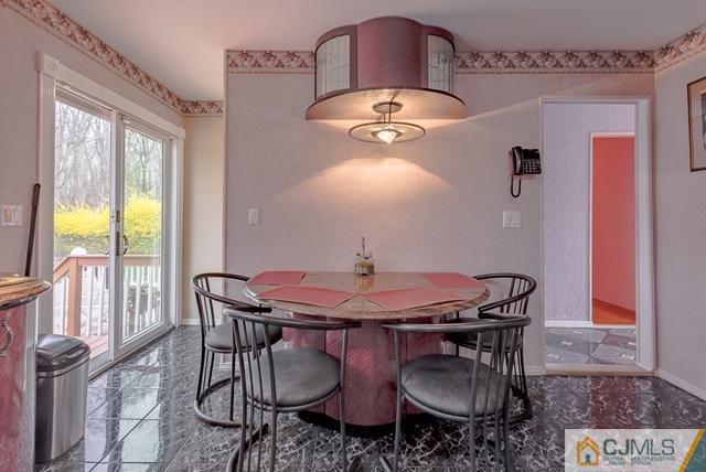 22 Kings Road East Brunswick, NJ 08816 - Photo 9 of 24 a view of a dining room with furniture and window