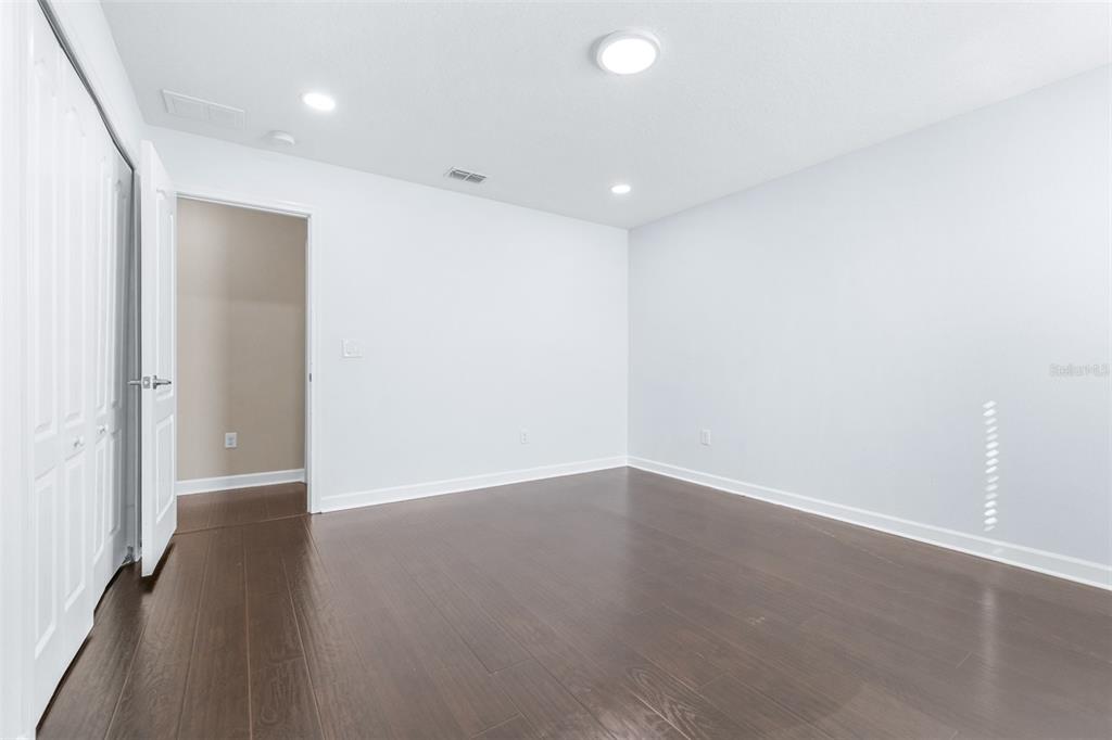 1762 Hadden Hall Place Trinity, FL 34655 - Photo 28 of 49 an empty room with wooden floor and windows