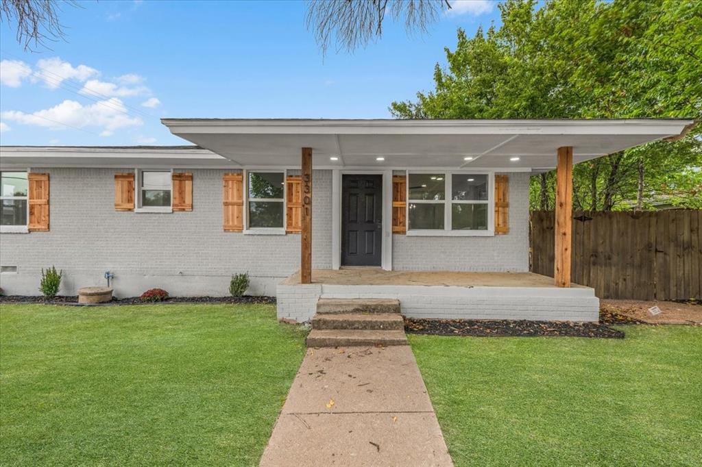 3301 Hedrick Street Fort Worth, TX 76111 - Photo 2 of 22 a front view of a house with a garden