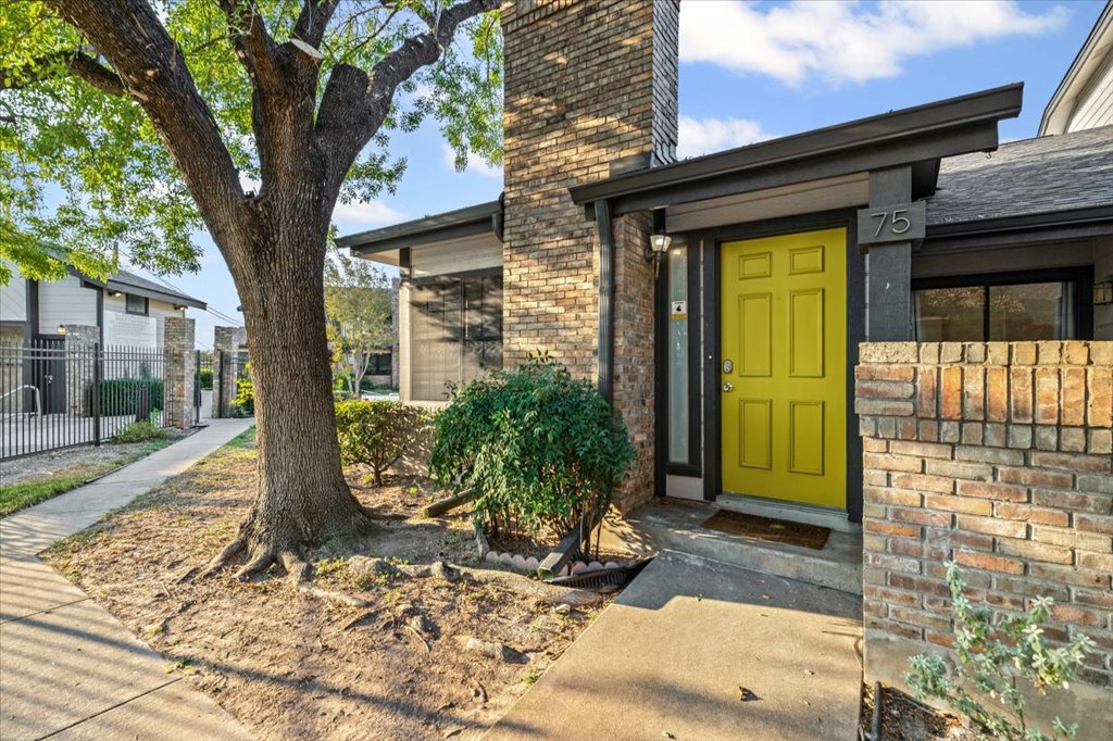1748 Ohlen Road, Unit 75 Austin, TX 78757 - Photo 1 of 33 Doorway to property featuring a chimney and brick siding