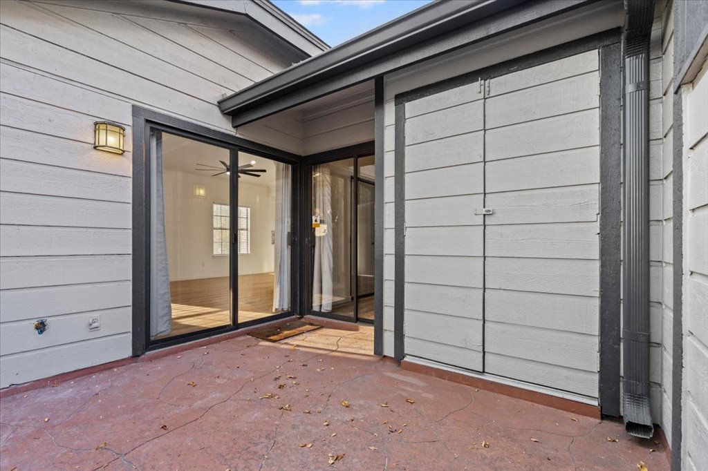 1748 Ohlen Road, Unit 75 Austin, TX 78757 - Photo 13 of 33 Doorway to property featuring a patio area