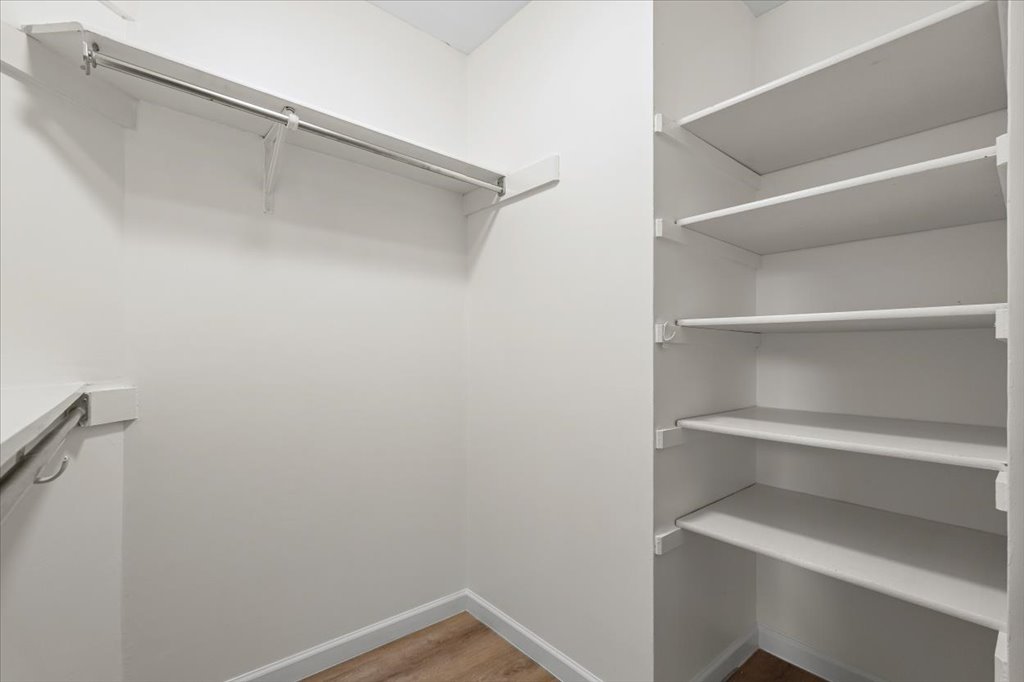 1748 Ohlen Road, Unit 75 Austin, TX 78757 - Photo 25 of 33 Spacious closet featuring light wood finished floors