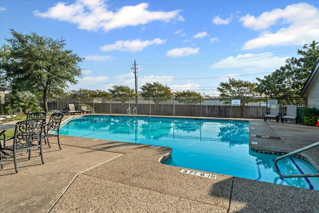 1748 Ohlen Road, Unit 75 Austin, TX 78757 - Photo 29 of 33 Community pool featuring a patio