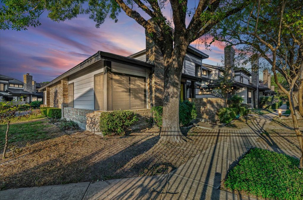 1748 Ohlen Road, Unit 75 Austin, TX 78757 - Photo 6 of 33 Property exterior at dusk featuring brick siding