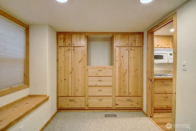 a view of walk in closet with chandelier