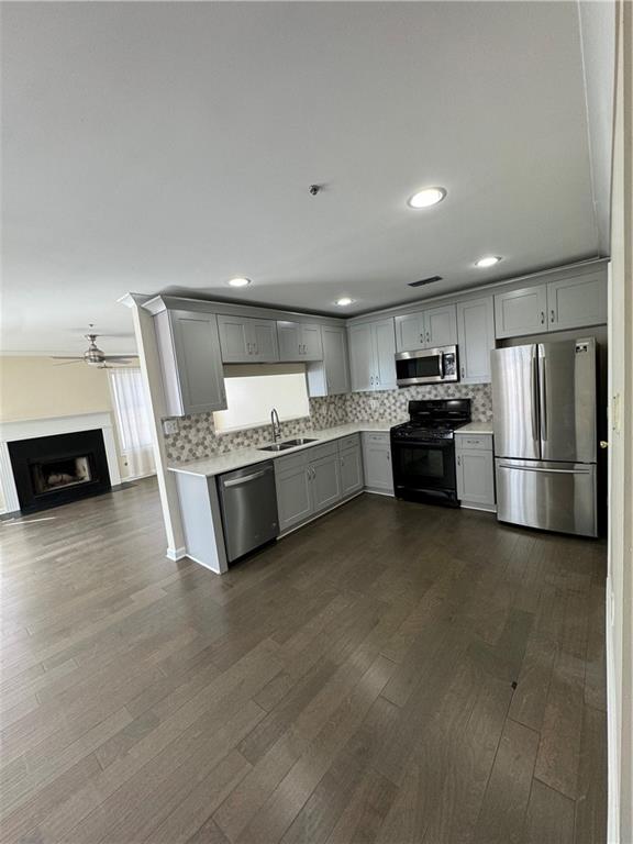 3468 Lehigh Way Decatur, GA 30034 - Photo 3 of 16 a kitchen with stainless steel appliances a sink a stove a microwave a refrigerator and cabinets