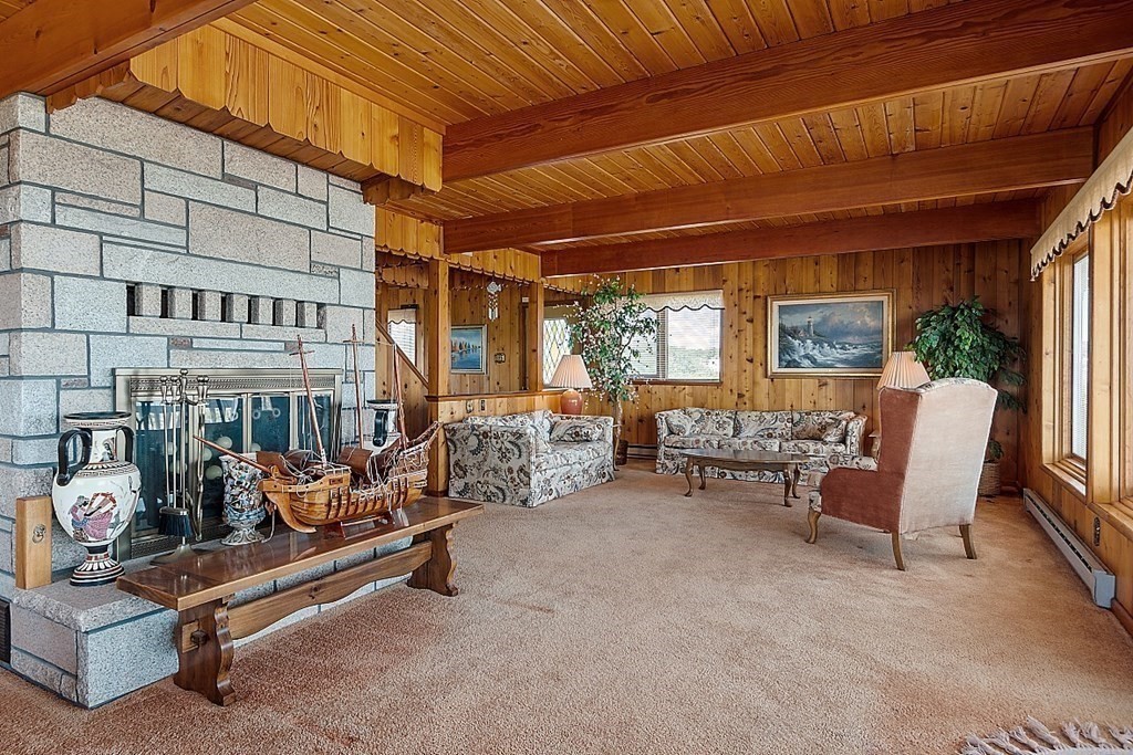 1585 Ocean Boulevard Rye, NH 03870 - Photo 29 of 41 a living room with furniture and a large window