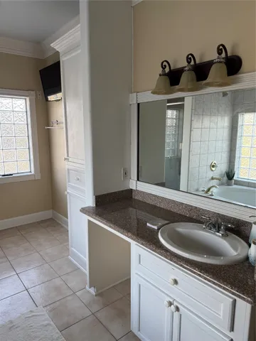 a bathroom with a sink double vanity and a mirror