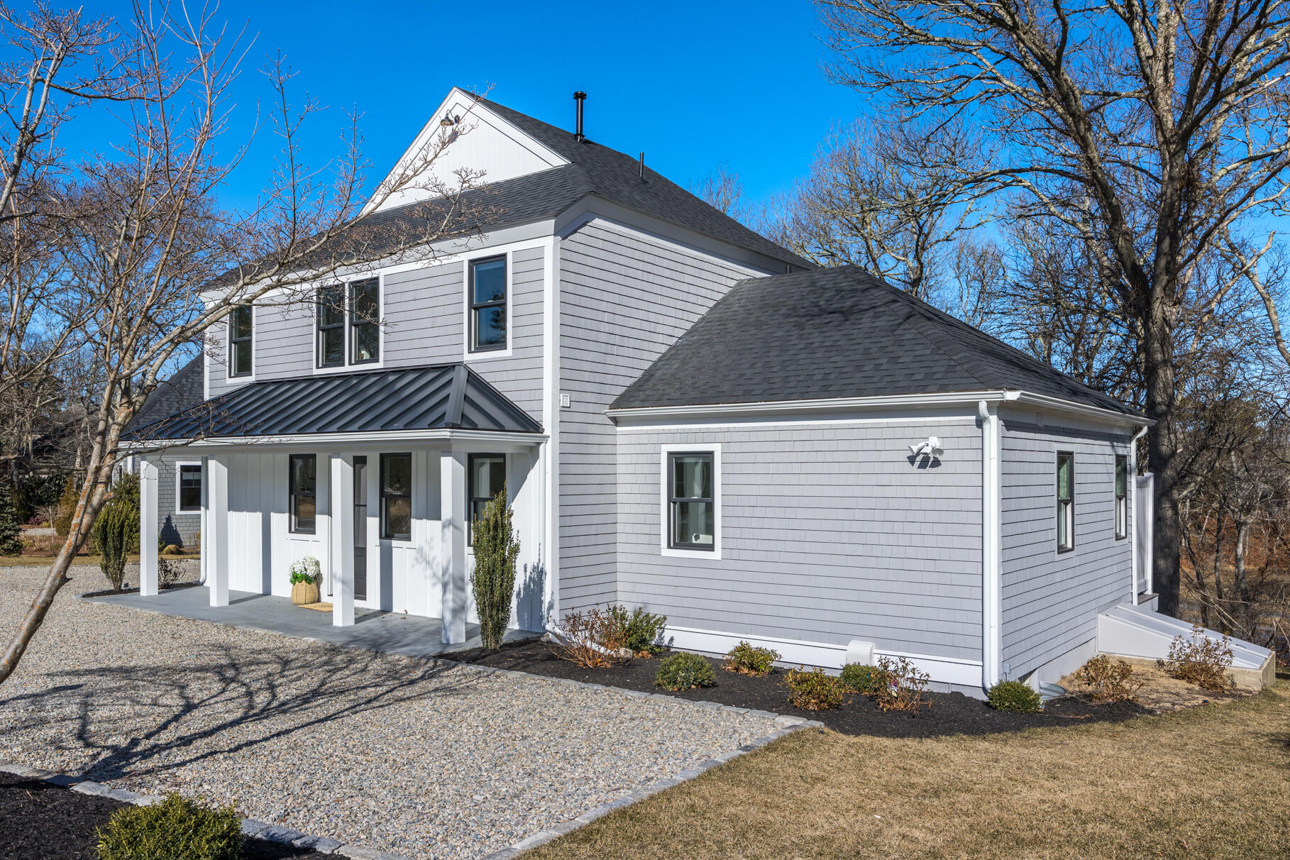 38 Summersea Road Mashpee, MA 02649 - Photo 3 of 64 a front view of a house with a yard and garage