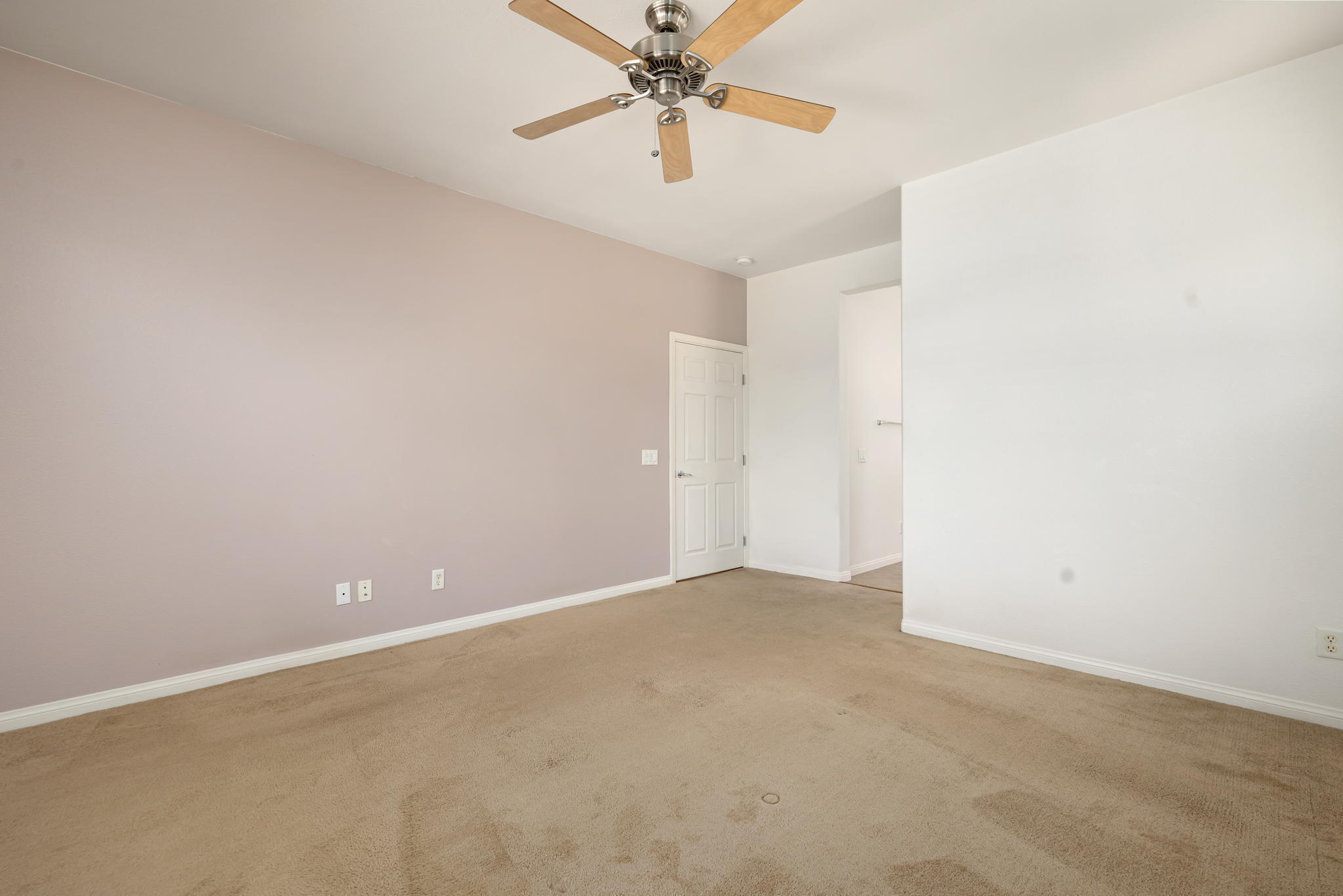49728 Pacino Street Indio, CA 92201 - Photo 28 of 54 an empty room with closet and a chandelier fan