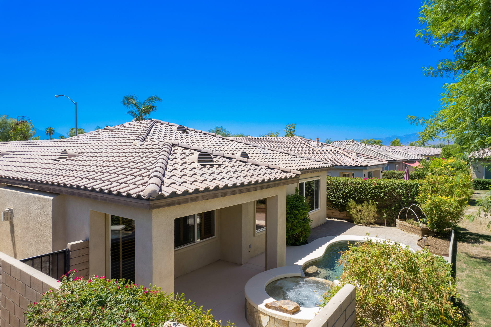 49728 Pacino Street Indio, CA 92201 - Photo 5 of 54 a front view of a house with a yard