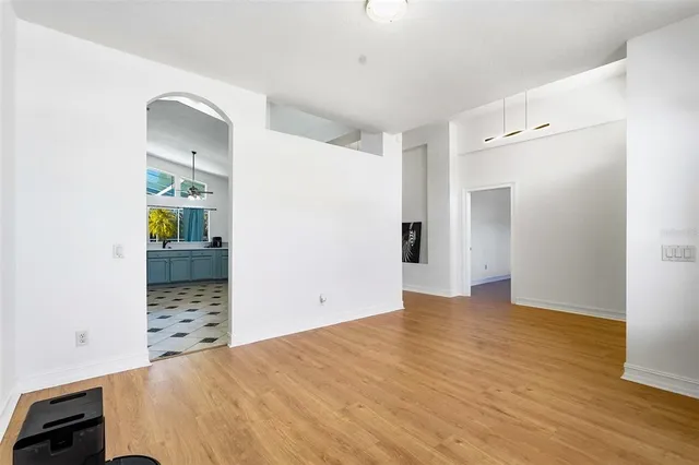 a view of a bedroom with wooden floor and cabinet
