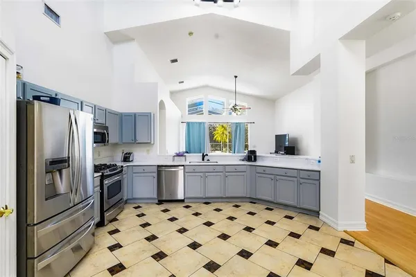 a kitchen with a sink stove and refrigerator