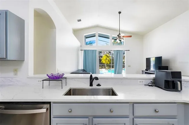 a kitchen with sink and window