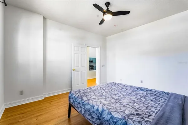 a bedroom with a bed and a dresser