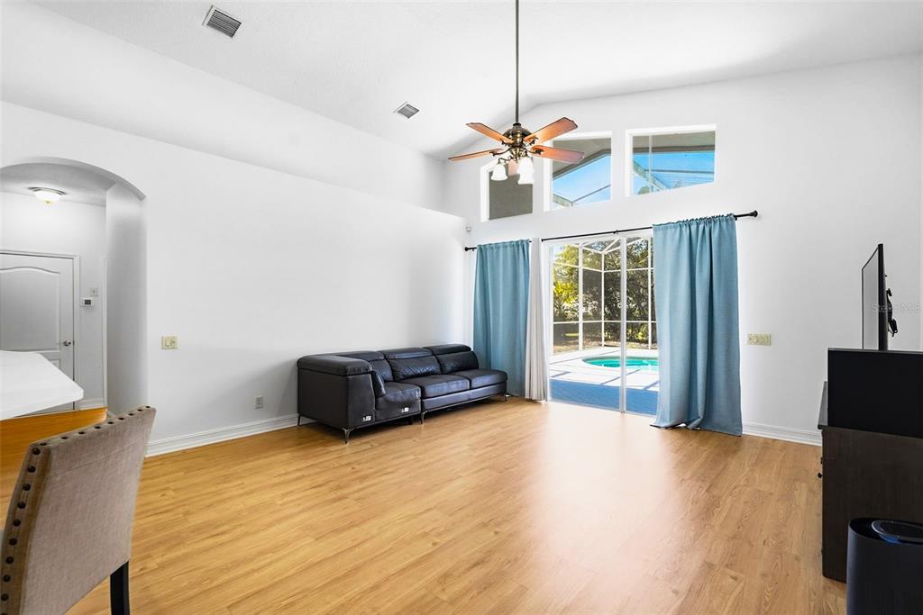 2807 Manning Drive Trinity, FL 34655 - Photo 23 of 48 a living room with furniture and wooden floor