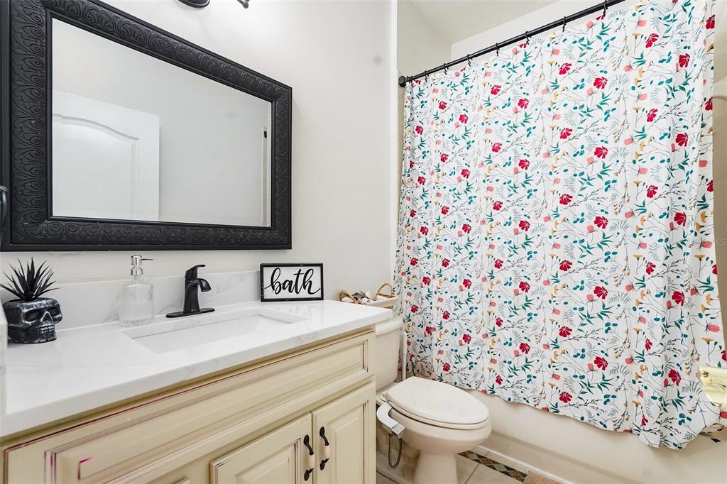 2807 Manning Drive Trinity, FL 34655 - Photo 29 of 48 a bathroom with a toilet sink and mirror