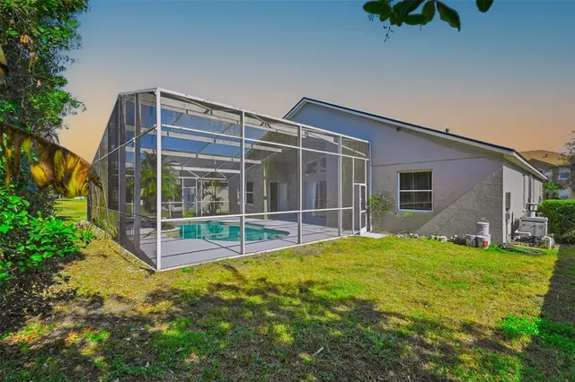 a view of a park with large trees and plants