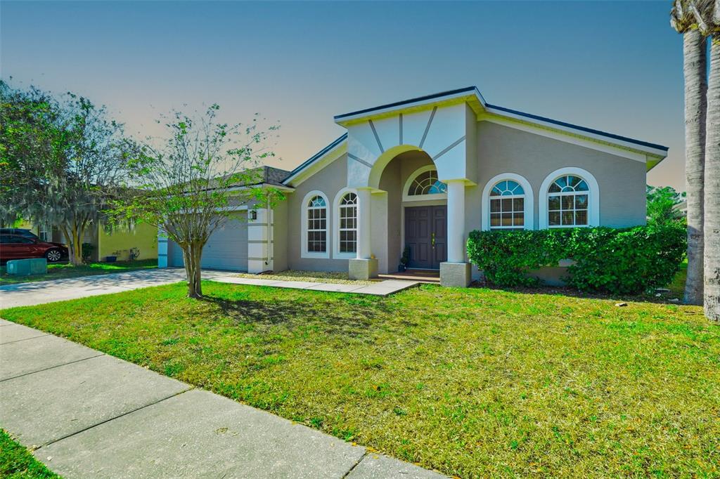 2807 Manning Drive Trinity, FL 34655 - Photo 5 of 48 a front view of a house with a yard