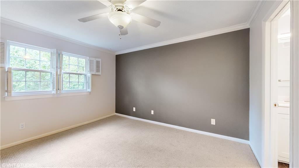 1177 Church Street, Unit C Decatur, GA 30030 - Photo 12 of 27 an empty room with a window and a fan