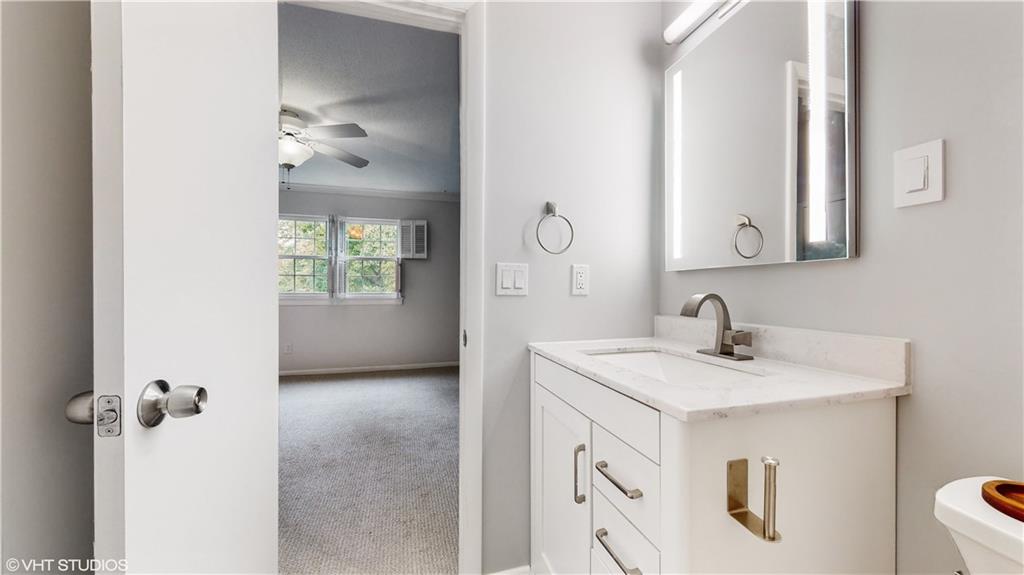 1177 Church Street, Unit C Decatur, GA 30030 - Photo 16 of 27 a bathroom with a sink vanity and mirror