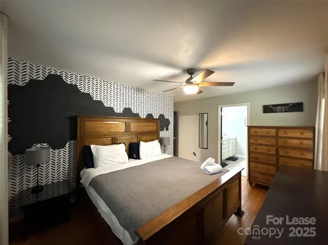 a bathroom with a double vanity sink a mirror and a bathtub