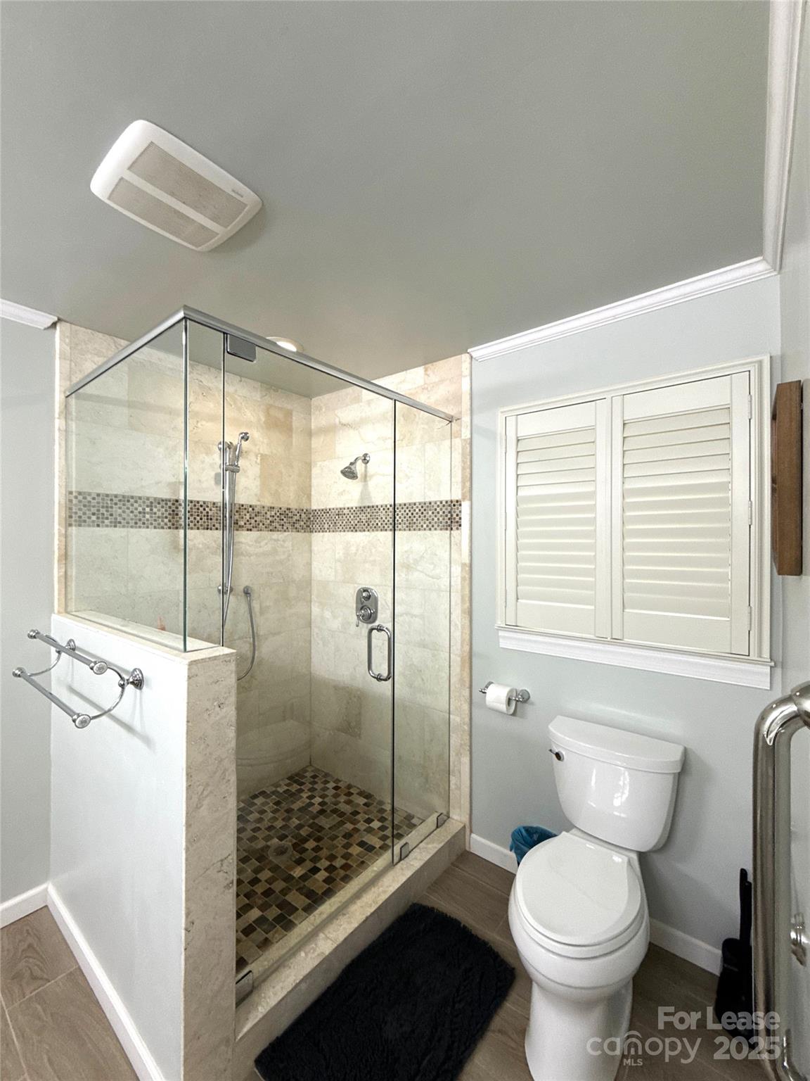 1600 Paddock Circle Charlotte, NC 28209 - Photo 18 of 34 a bathroom with a toilet and a shower