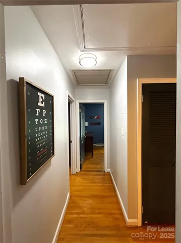 a bedroom with a bed and a television