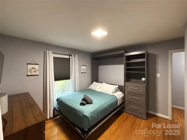 a bathroom with a toilet a sink and shower