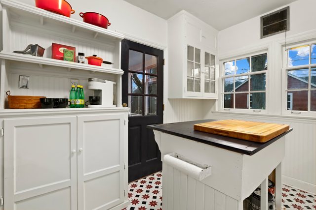 3022 Thayer Street Evanston, IL 60201 - Photo 13 of 23 a kitchen with stainless steel appliances a sink and a refrigerator