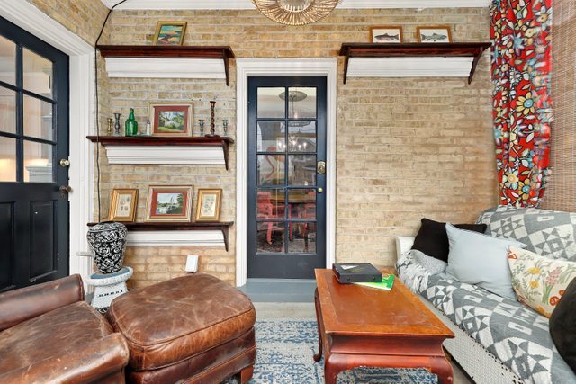 3022 Thayer Street Evanston, IL 60201 - Photo 17 of 23 a living room with furniture and a fireplace