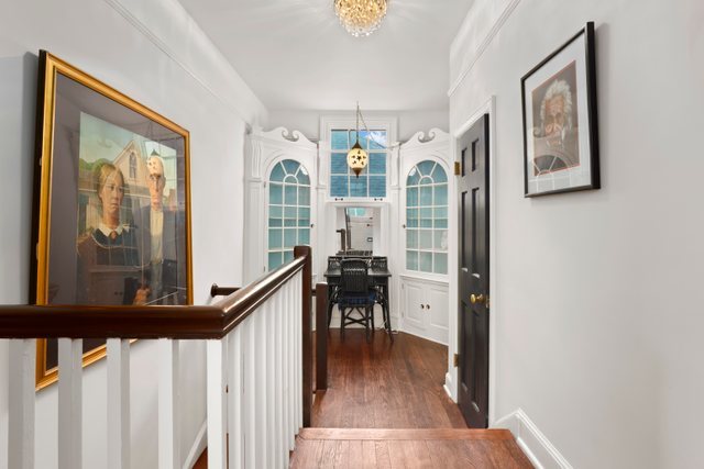 3022 Thayer Street Evanston, IL 60201 - Photo 19 of 23 a view of a hallway with wooden floor and furniture
