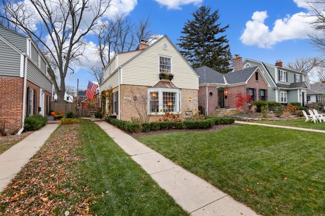 3022 Thayer Street Evanston, IL 60201 - Photo 2 of 23 a front view of a house with a yard