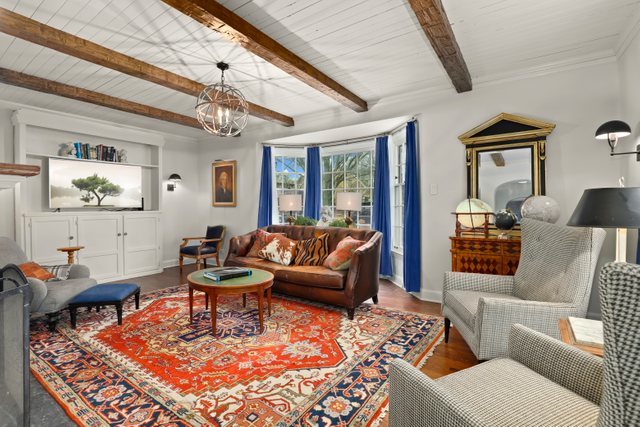 3022 Thayer Street Evanston, IL 60201 - Photo 3 of 23 a living room with furniture a rug and a chandelier