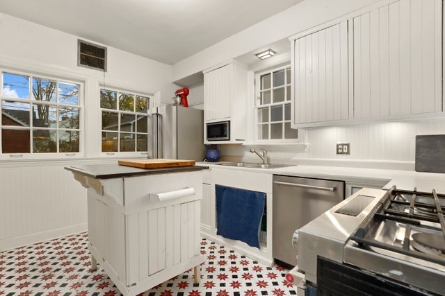 3022 Thayer Street Evanston, IL 60201 - Photo 10 of 23 a kitchen with a sink stove and microwave